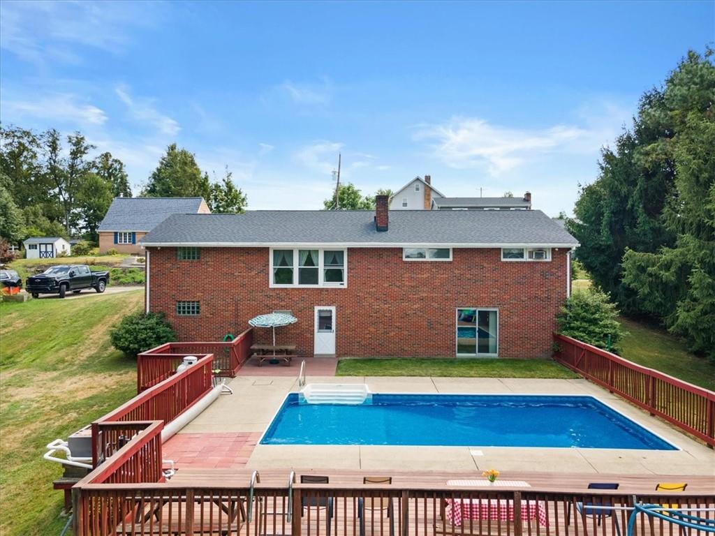 1891 Concord Drive Ambridge, PA 15003 - Photo 3 of 40 a view of swimming pool with a lounge chairs