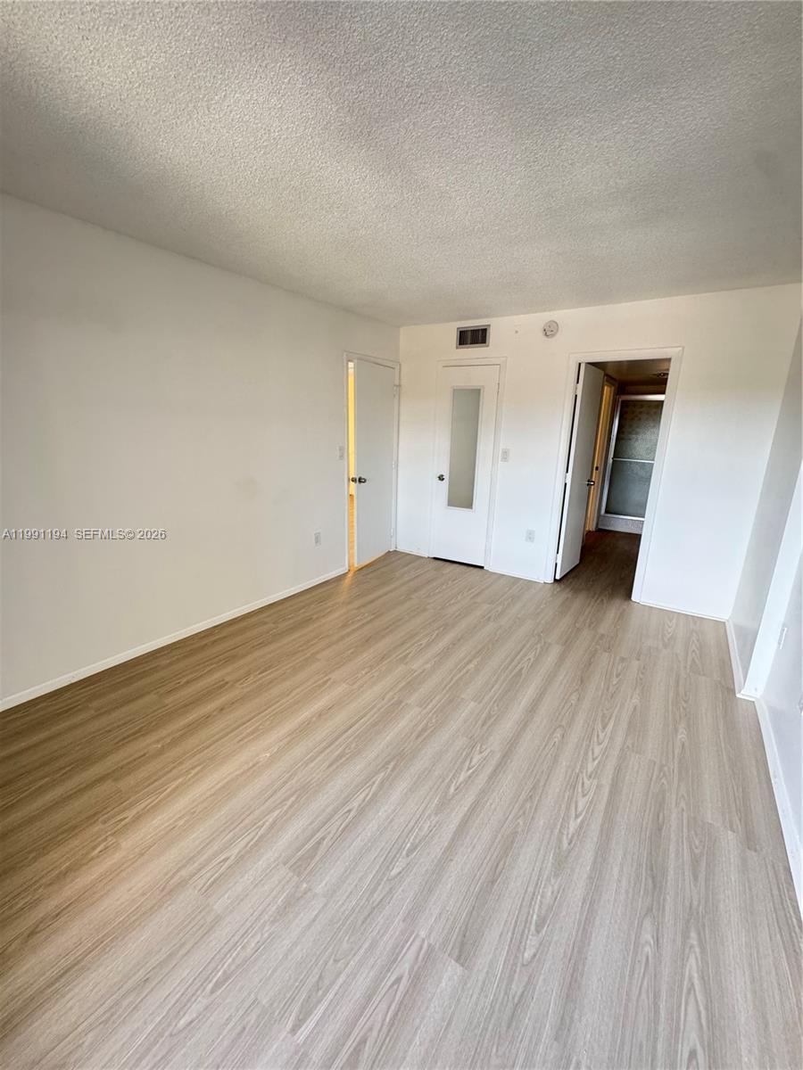4160 Inverrary Drive, Unit 510 Lauderhill, FL 33319 - Photo 15 of 25 a view of an empty room and wooden floor