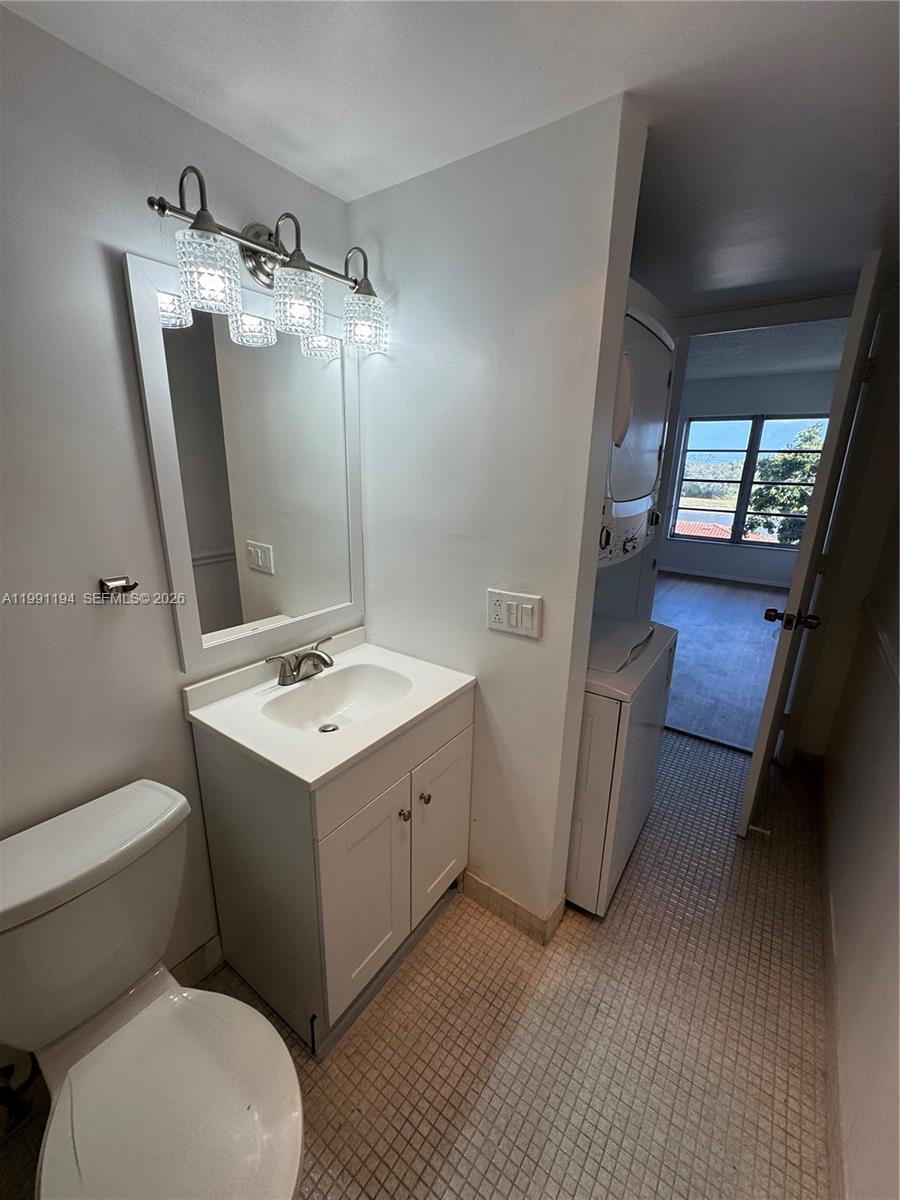 4160 Inverrary Drive, Unit 510 Lauderhill, FL 33319 - Photo 18 of 25 a bathroom with a sink a toilet and mirror