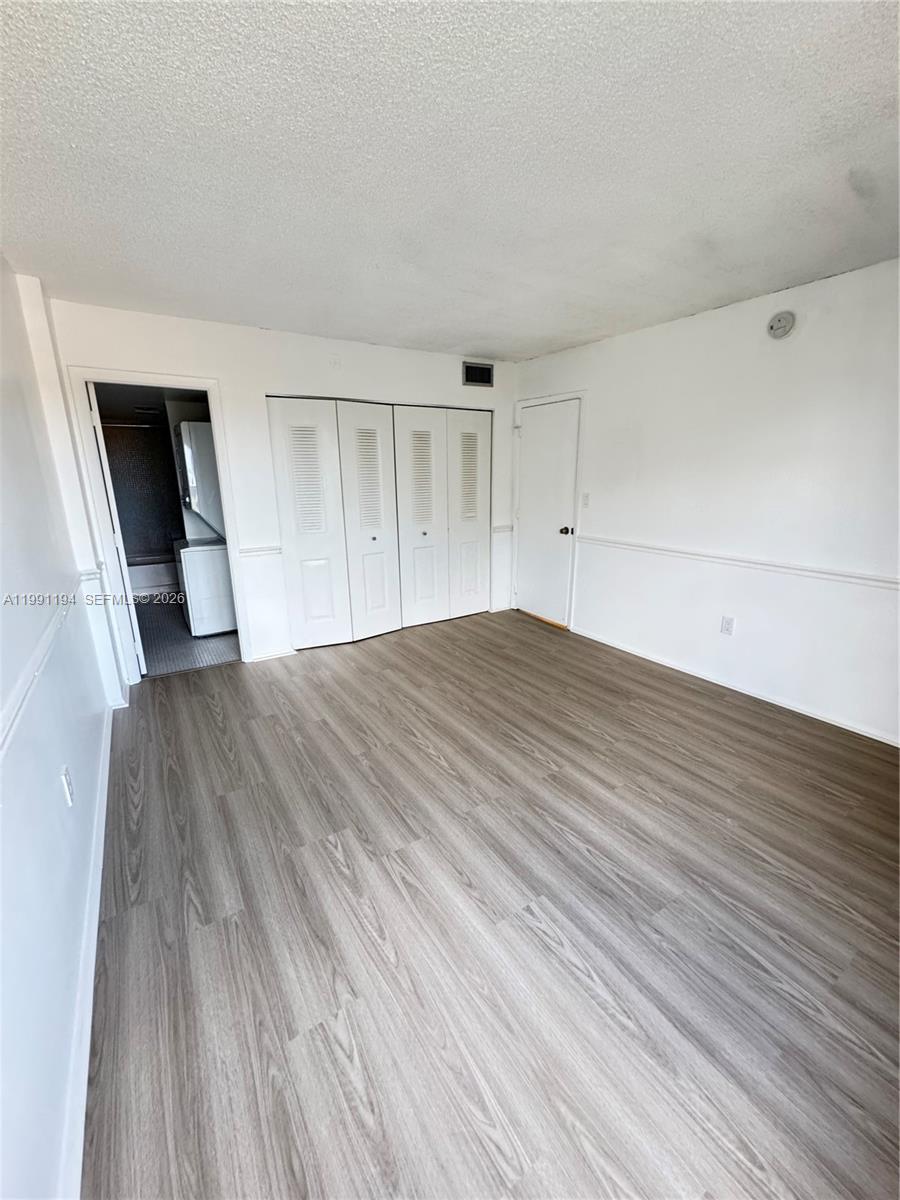 4160 Inverrary Drive, Unit 510 Lauderhill, FL 33319 - Photo 21 of 25 a view of empty room with wooden floor and fan