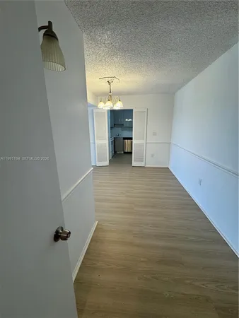 a view of a livingroom with wooden floor