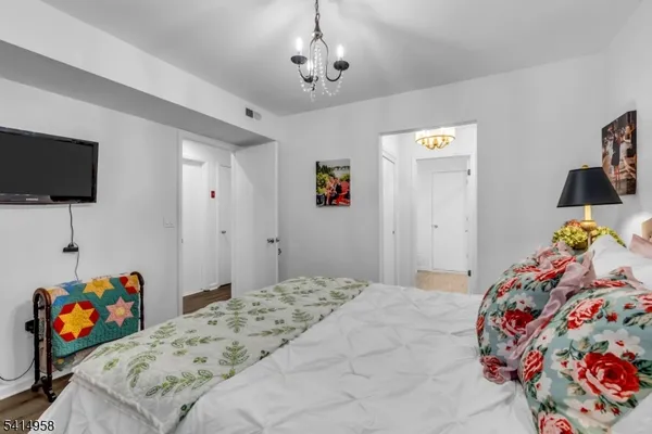 a bedroom that has a bed and a tv in it