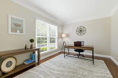 a view of a workspace with a window and sitting area