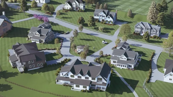 an aerial view of a house with a swimming pool patio and outdoor seating