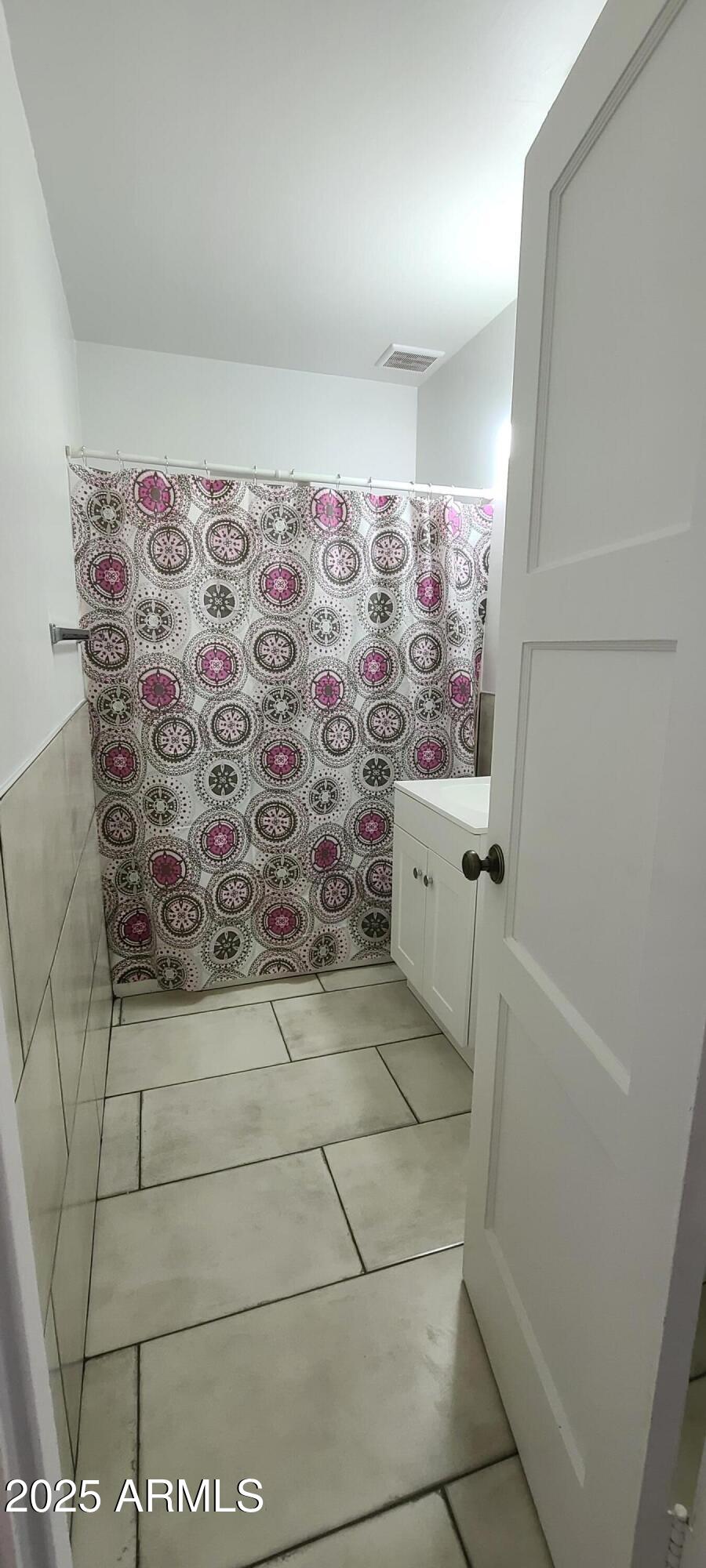 1234 South Farmer Avenue Tempe, AZ 85281 - Photo 19 of 47 a bathroom with a bathtub and shower