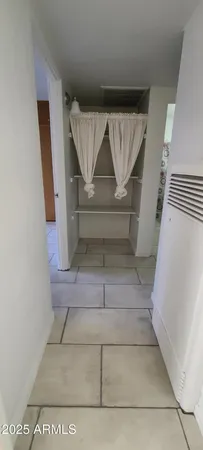 a view of empty room with a fireplace