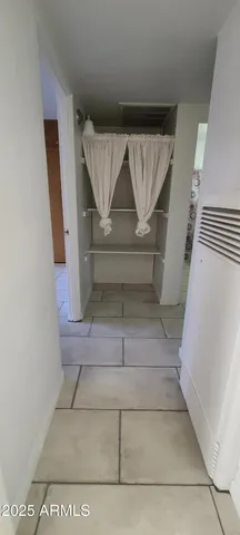 a view of empty room with a fireplace