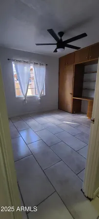 a view of an empty room and window