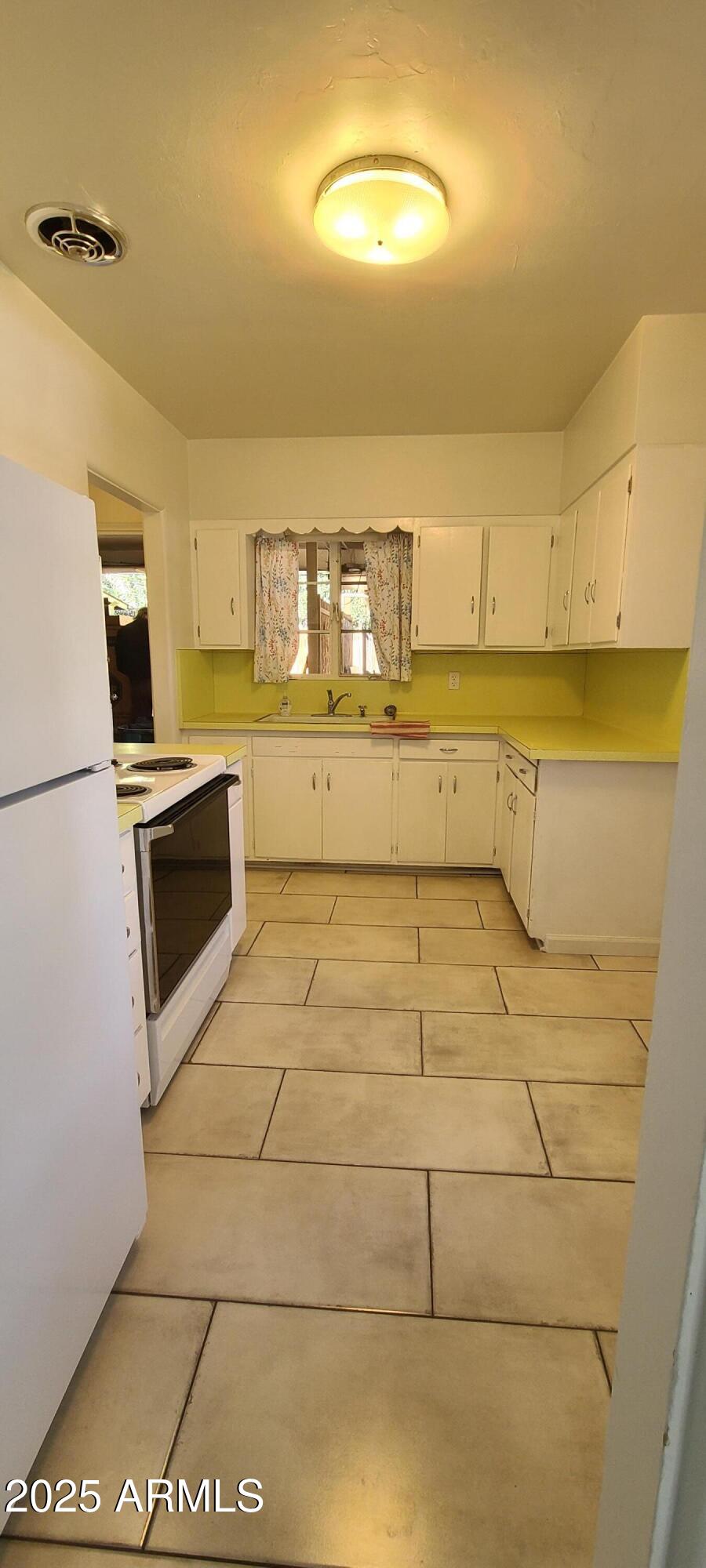 1234 South Farmer Avenue Tempe, AZ 85281 - Photo 27 of 47 a bathroom with a sink a toilet and dryer