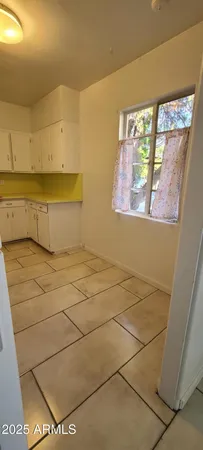 en empty room with windows