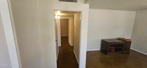 a view of a livingroom with wooden floor
