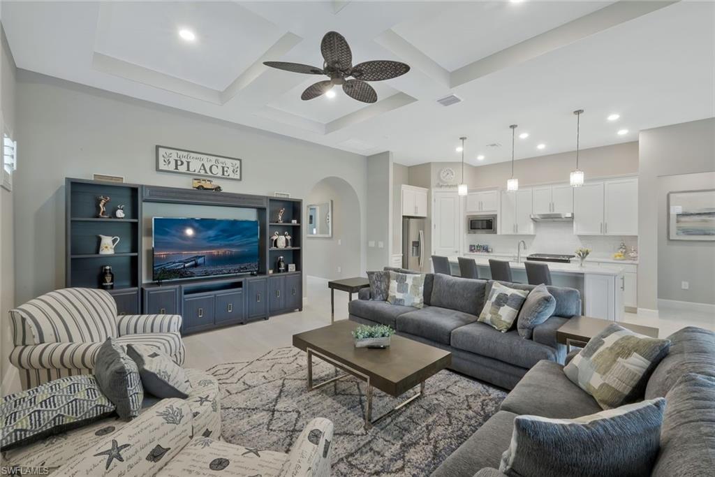 9640 Everglades Boulevard North Naples, FL 34120 - Photo 14 of 49 a living room with furniture and a flat screen tv