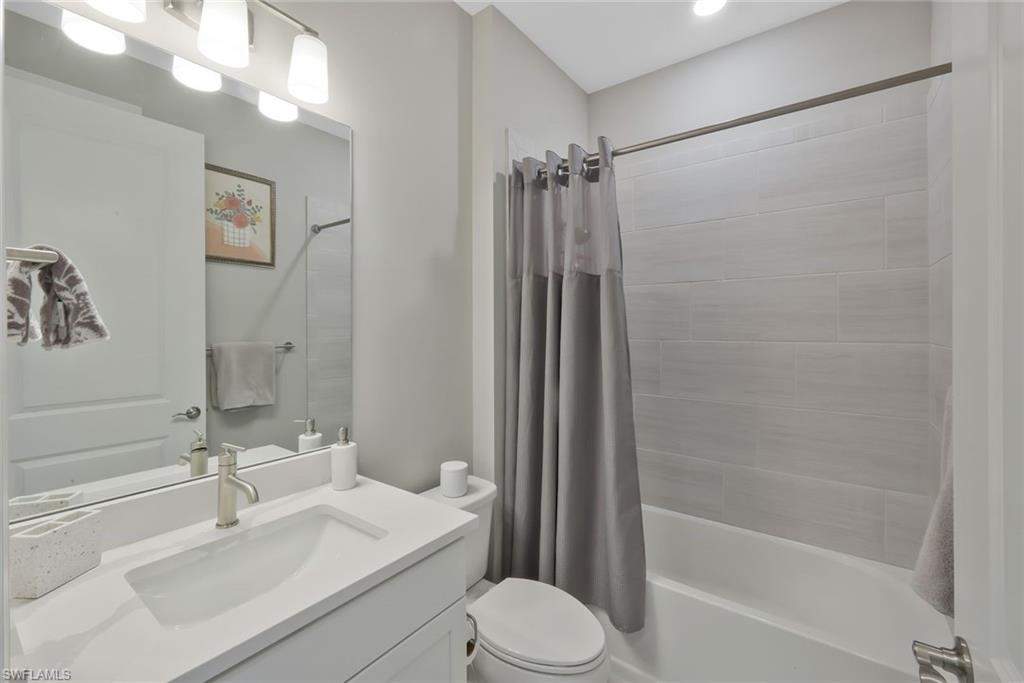 9640 Everglades Boulevard North Naples, FL 34120 - Photo 22 of 49 a bathroom with a sink toilet and shower