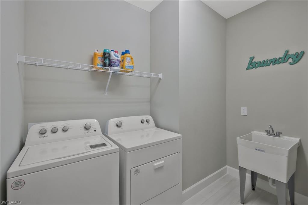 9640 Everglades Boulevard North Naples, FL 34120 - Photo 23 of 49 a utility room with dryer and washer