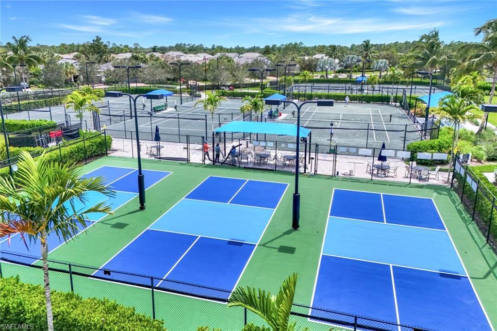 9640 Everglades Boulevard North Naples, FL 34120 - Photo 41 of 49 a view of yard with swimming pool and outdoor seating