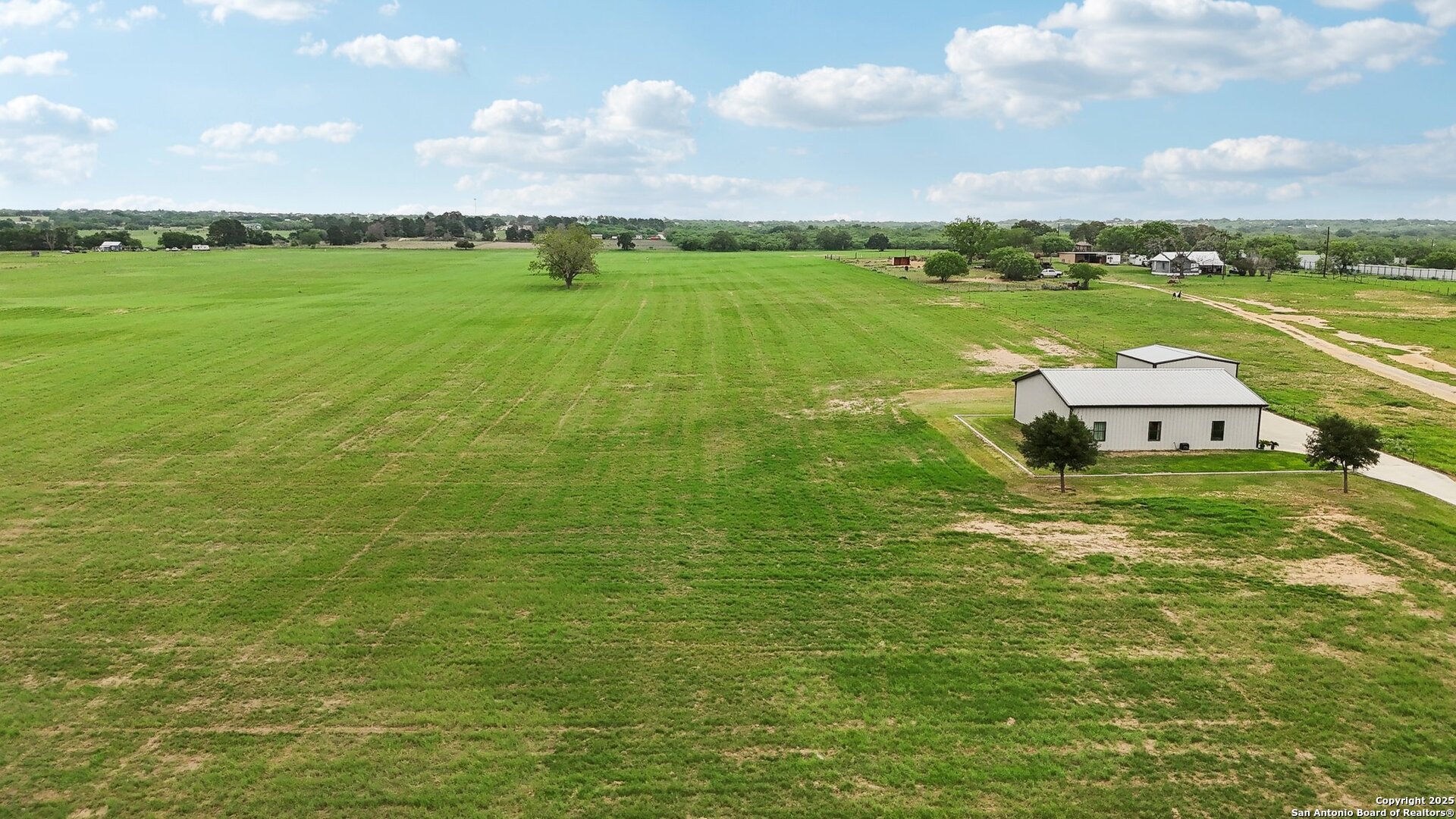 12885 La Vernia Road St. Hedwig, TX 78152 - Photo 9 of 22 a aerial view of a houses with outdoor space and swimming pool