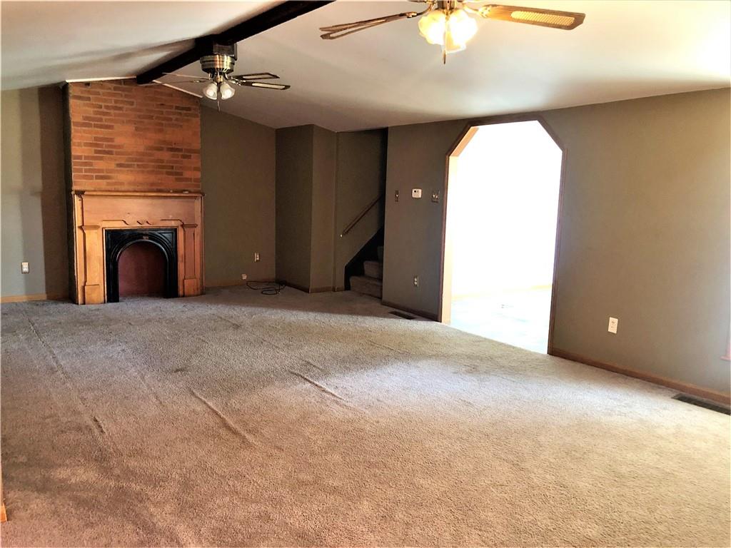 651 Lone Pine Road Washington, PA 15301 - Photo 3 of 16 a view of an empty room with a fireplace