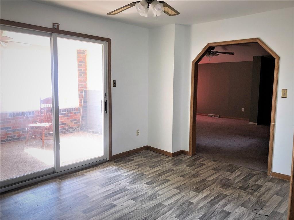 651 Lone Pine Road Washington, PA 15301 - Photo 4 of 16 a view of empty room with wooden floor and fan