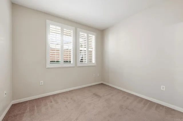 a view of a swimming pool with outdoor seating