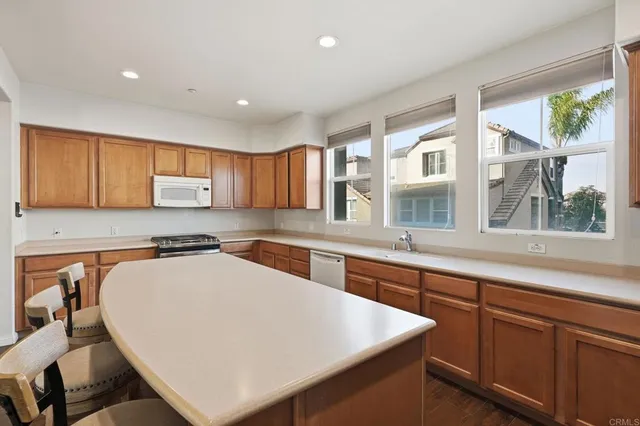 a view of a livingroom with a hardwood floor and a ceiling fan