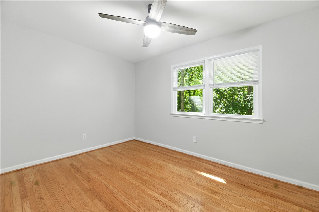 111 Braddock Road Williamsburg, VA 23185 - Photo 22 of 43 Unfurnished room featuring light wood finished floors and ceiling fan