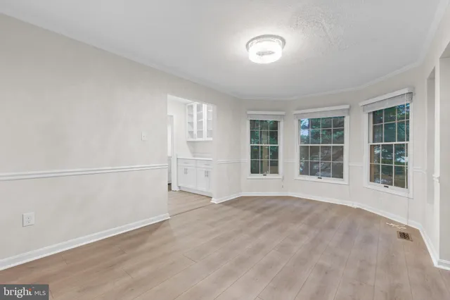 a kitchen with a refrigerator and a sink