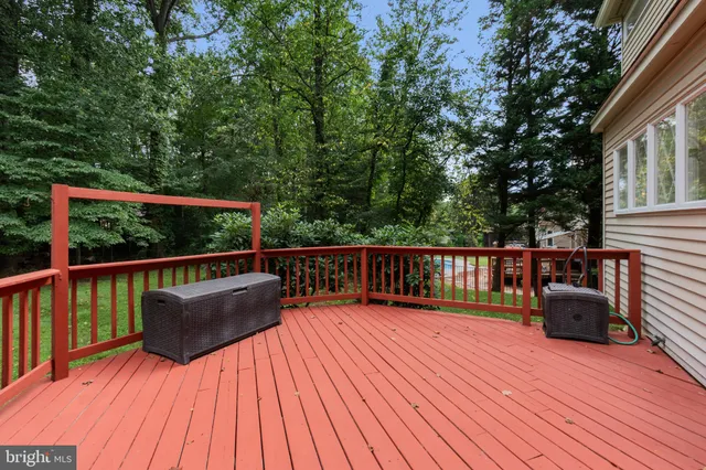 an empty room with a ceiling fan and a window