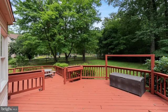 an empty room with a empty space and windows
