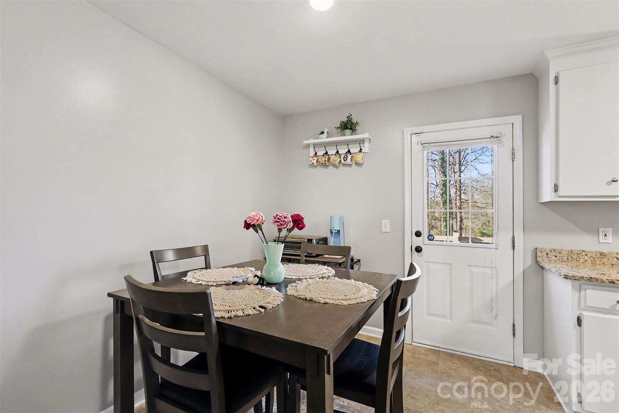 1318 Ridgewood Drive Concord, NC 28027 - Photo 11 of 27 a view of a dining room with furniture window and outside view