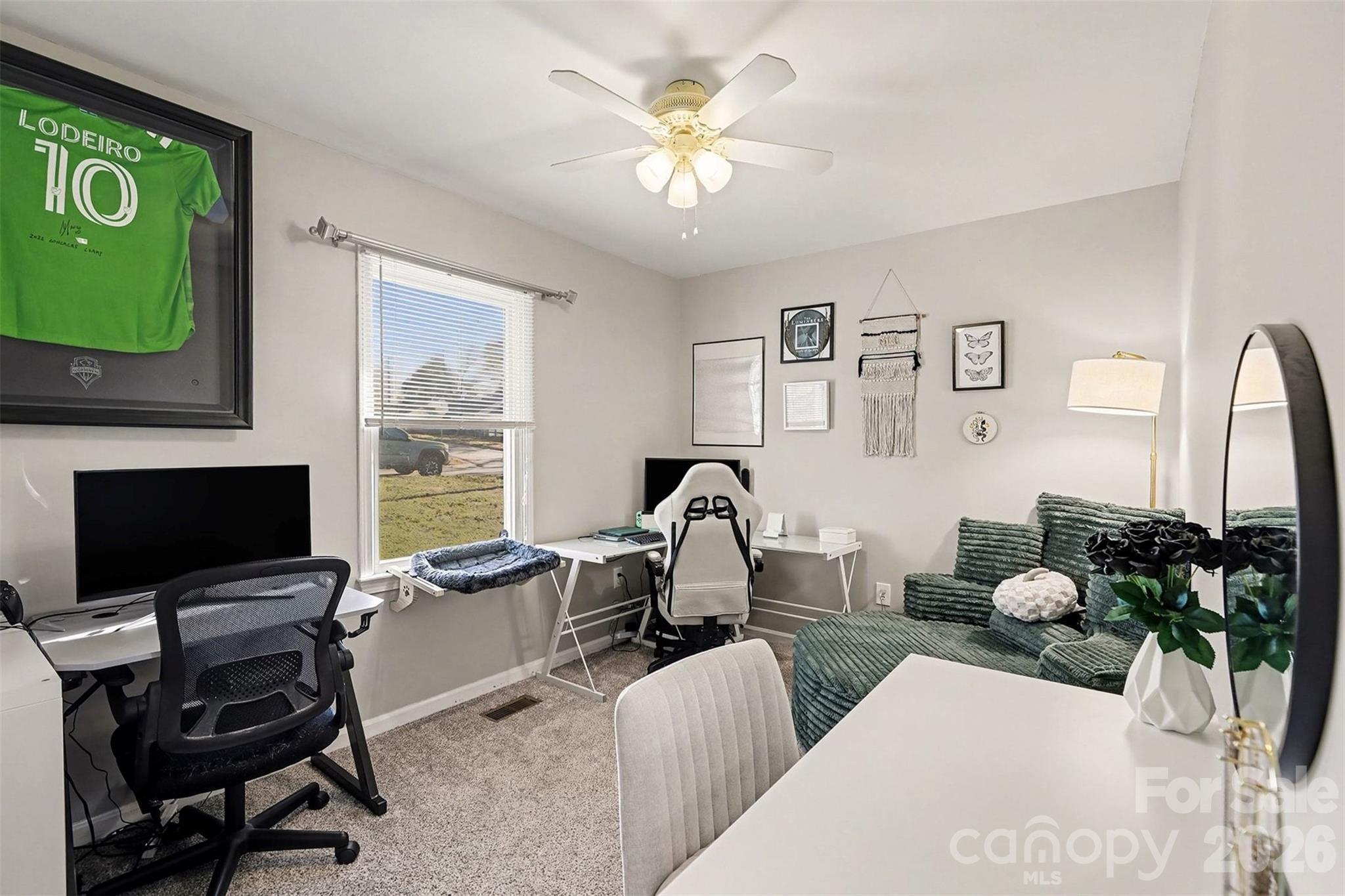 1318 Ridgewood Drive Concord, NC 28027 - Photo 16 of 27 a living room with furniture a flat screen tv and a window