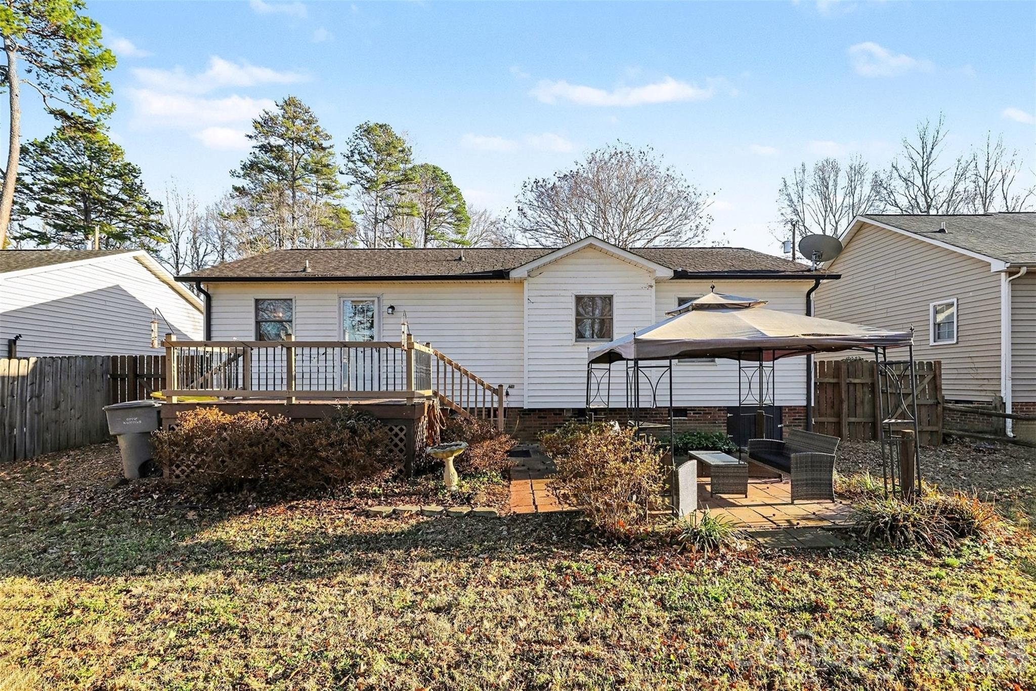 1318 Ridgewood Drive Concord, NC 28027 - Photo 22 of 27 a front view of a house with garden