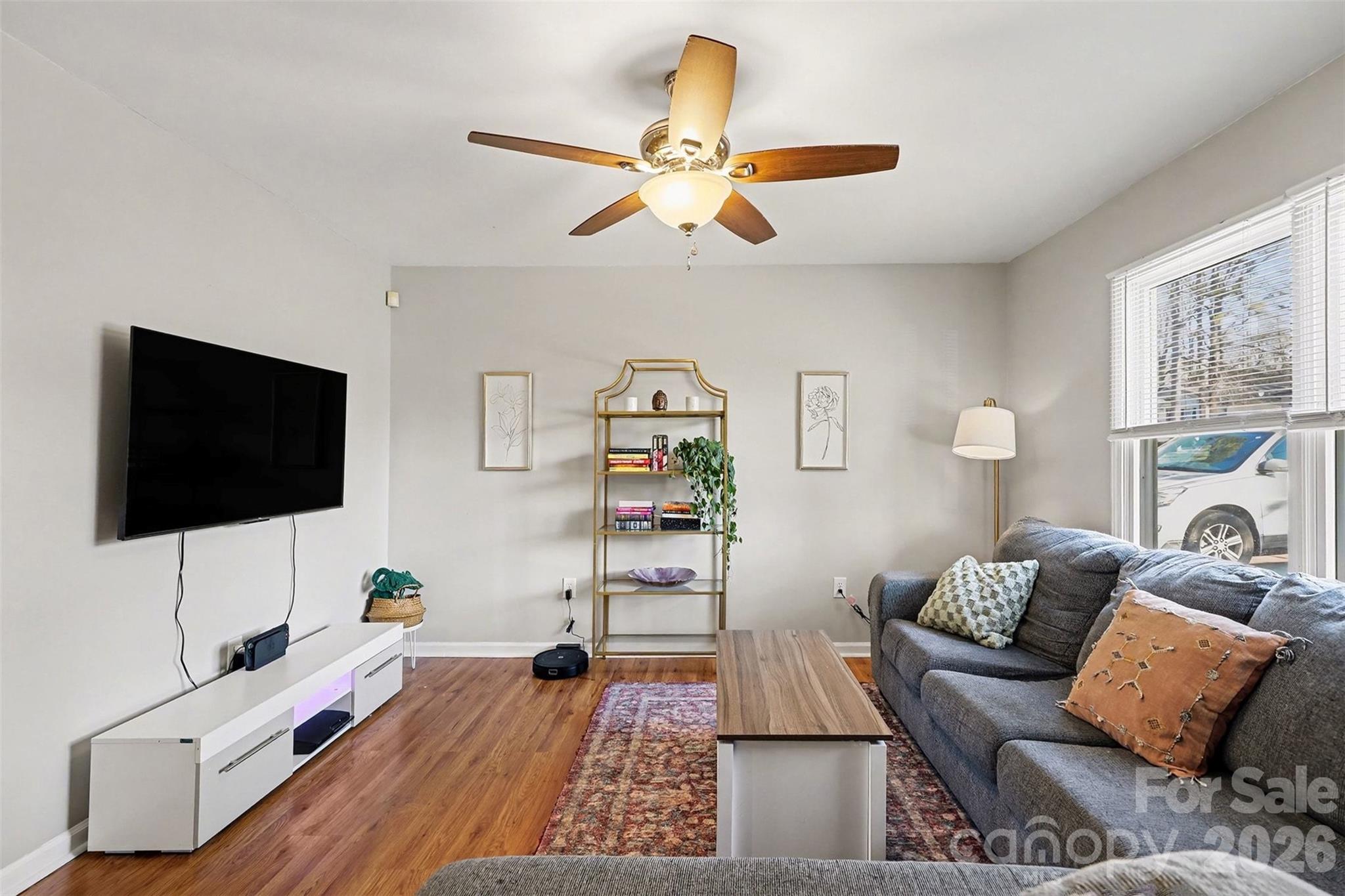 1318 Ridgewood Drive Concord, NC 28027 - Photo 3 of 27 a living room with furniture and a flat screen tv