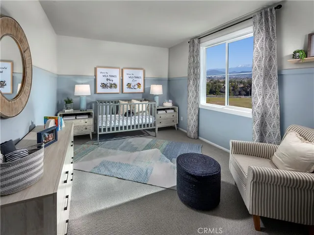 a bedroom with furniture and a window