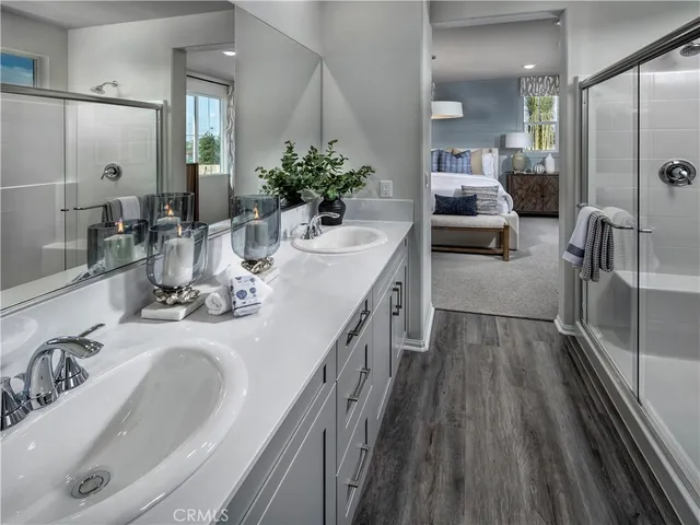 a bathroom with a double vanity sink and a mirror