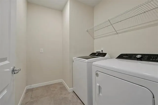 a utility room with dryer and washer