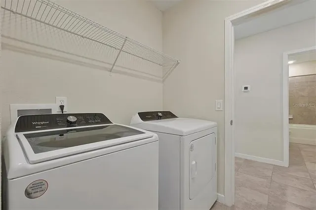 a utility room with dryer and washer