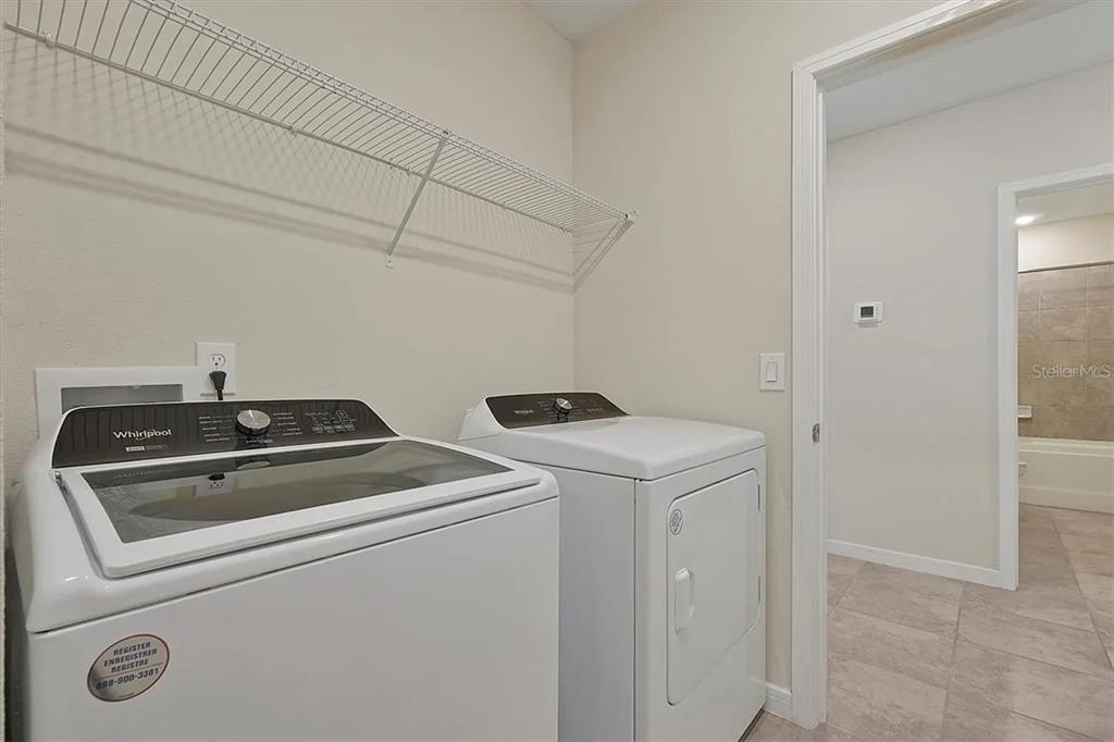 929 Rivers Crossing Street Clermont, FL 34714 - Photo 15 of 31 a utility room with dryer and washer