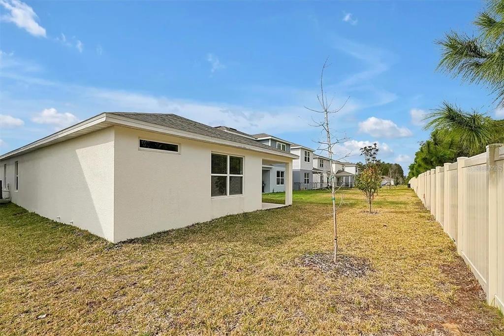 929 Rivers Crossing Street Clermont, FL 34714 - Photo 23 of 31 a view of a house with backyard