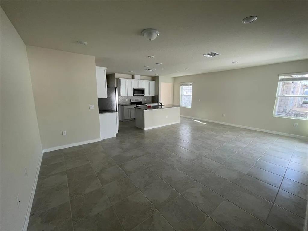 929 Rivers Crossing Street Clermont, FL 34714 - Photo 4 of 31 a view of a kitchen with a sink