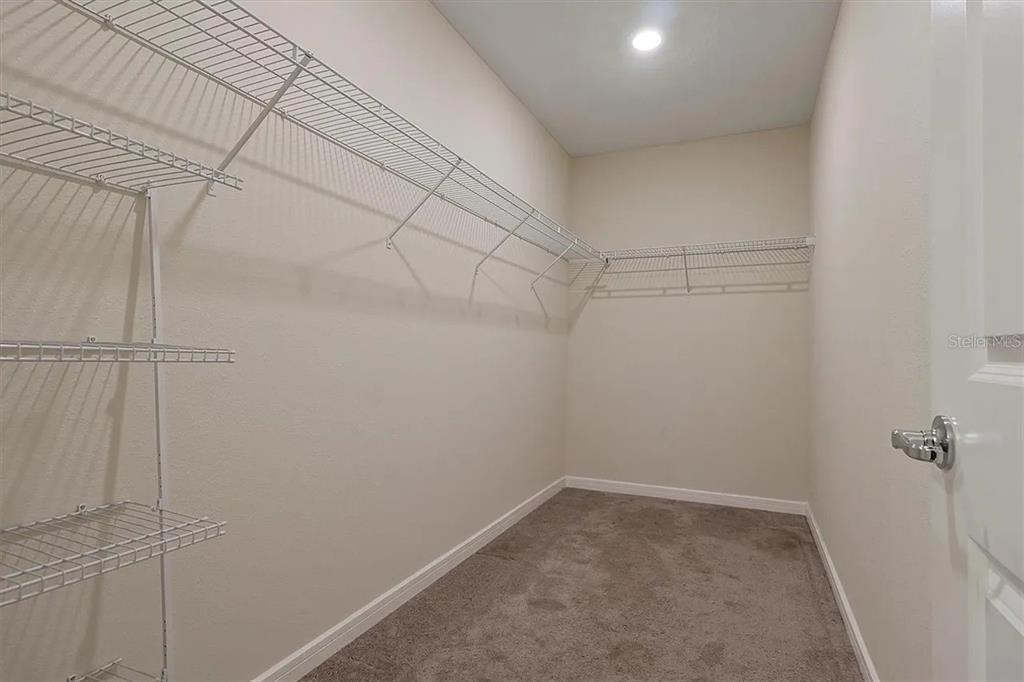 929 Rivers Crossing Street Clermont, FL 34714 - Photo 7 of 31 a view of a room with racks on the wall