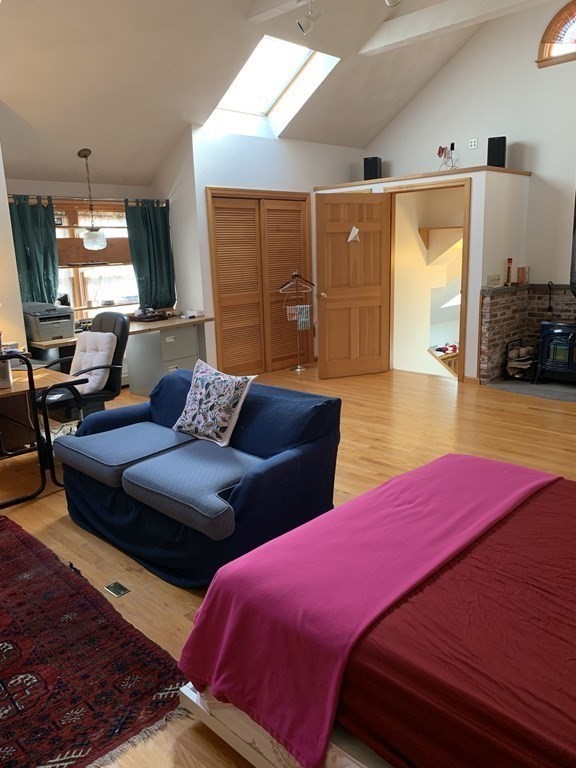 17 Everett Street Sherborn, MA 01770 - Photo 12 of 20 a bedroom with a bed and wooden floor