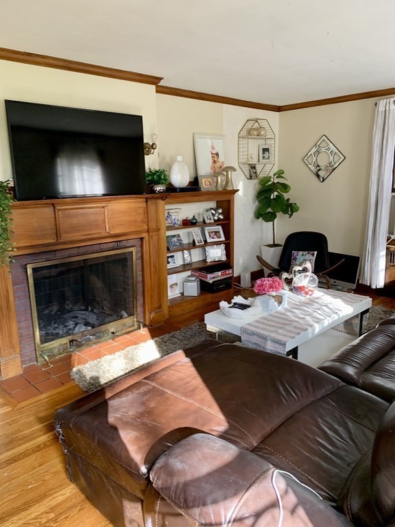 17 Everett Street Sherborn, MA 01770 - Photo 5 of 20 a bedroom with furniture and a fireplace