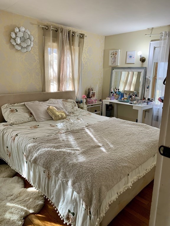 17 Everett Street Sherborn, MA 01770 - Photo 7 of 20 a bedroom with a bed and a painting on the wall