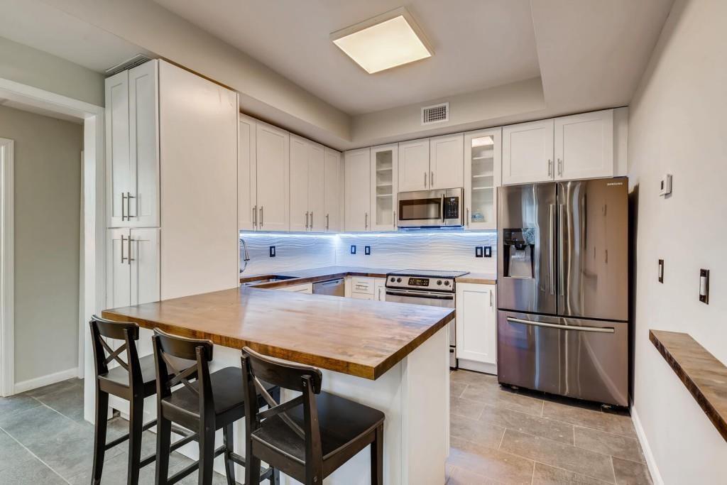 2897 White Oak Drive Decatur, GA 30032 - Photo 13 of 17 a kitchen with appliances cabinets and wooden floor