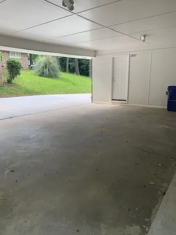 a view of house with backyard