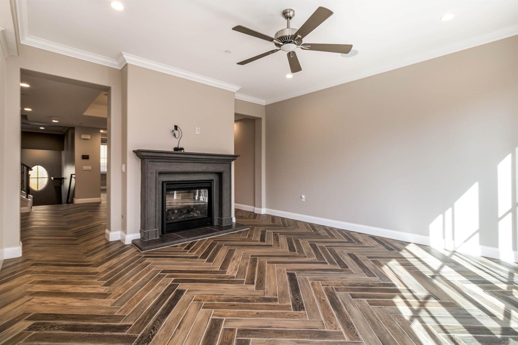 728 Silver Street La Jolla, CA 92037 - Photo 11 of 44 a view of a livingroom with wooden floor and a fireplace