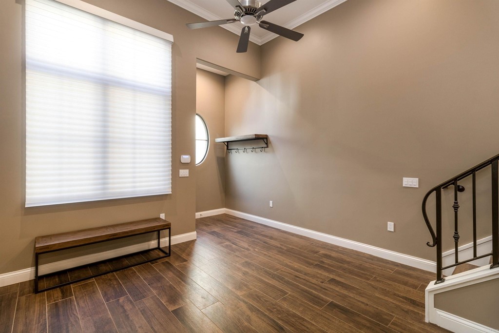 728 Silver Street La Jolla, CA 92037 - Photo 16 of 44 a view of a room with wooden floor and fan