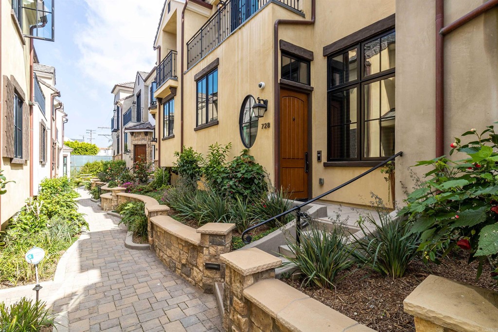 728 Silver Street La Jolla, CA 92037 - Photo 2 of 44 a view of a patio with table and chairs and potted plants