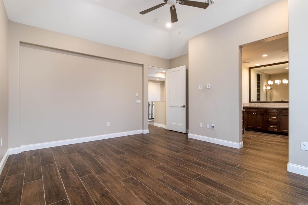 728 Silver Street La Jolla, CA 92037 - Photo 26 of 44 an empty room with wooden floor and mirror