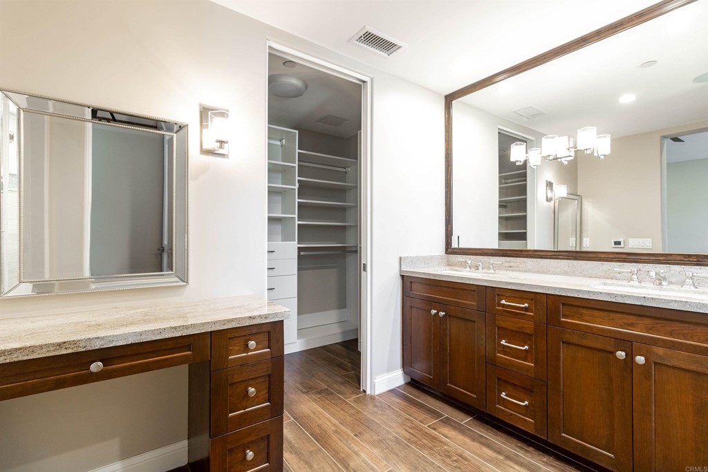 728 Silver Street La Jolla, CA 92037 - Photo 28 of 44 a bathroom with a sink double vanity and a mirror